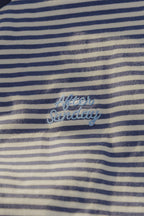 Close up of navy and white striped tee with After Sunday embroidery
